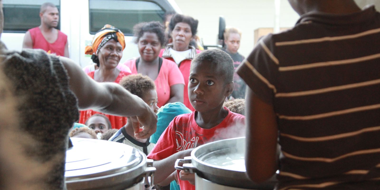 Vanuatu_feeding_young_boy